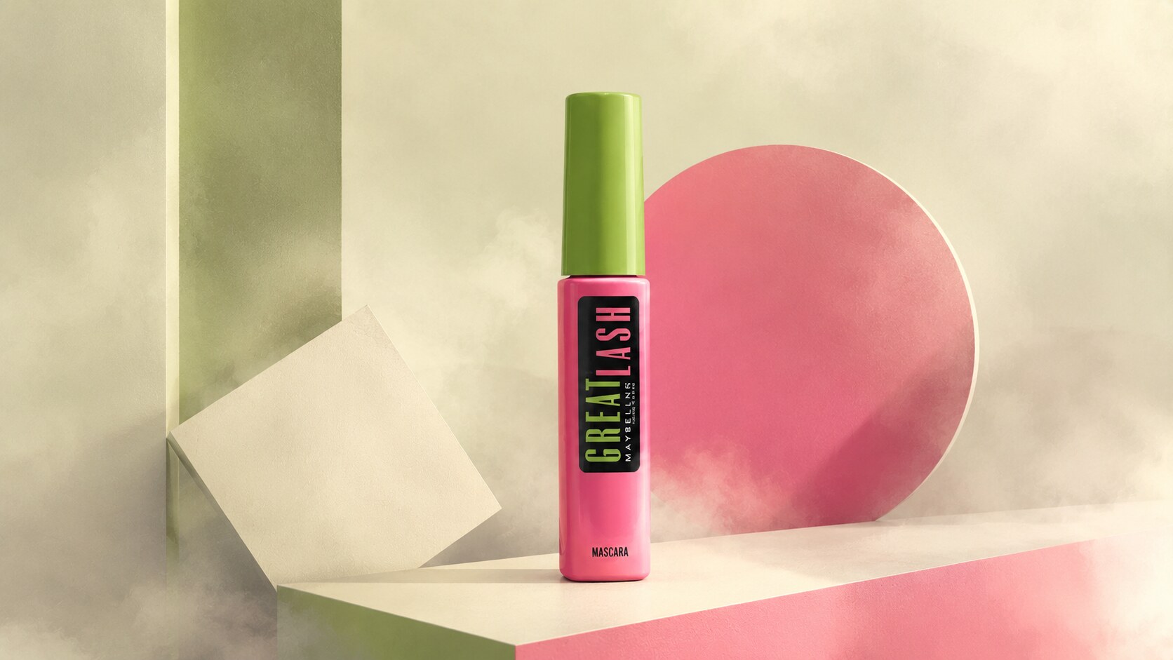 Maybelline Great Lash mascara tube in bright pink and green showing its highly recognizable color contrast.