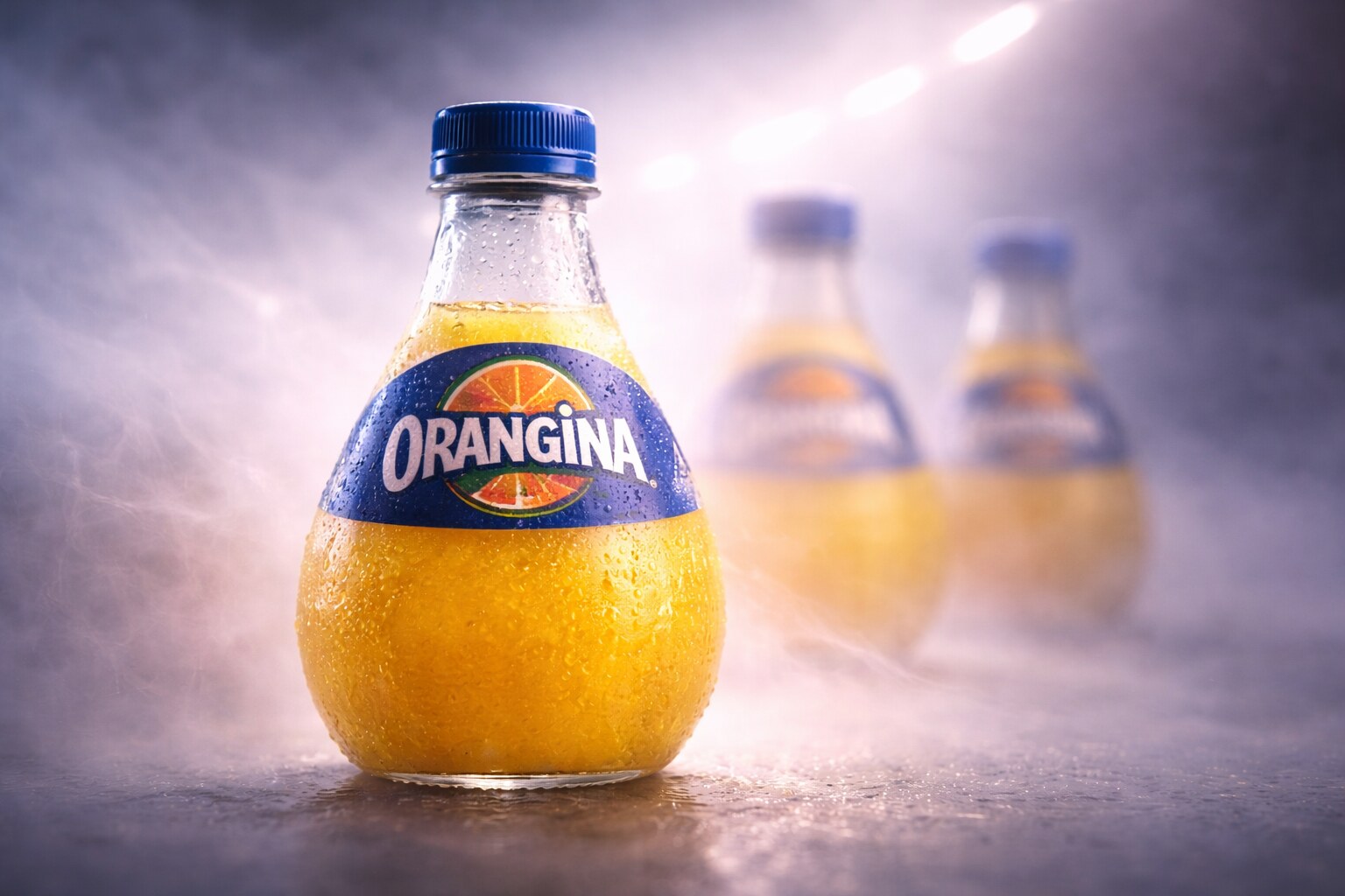 Orangina bottle design uses orange-like shape, texture, and ritual to become memorable.