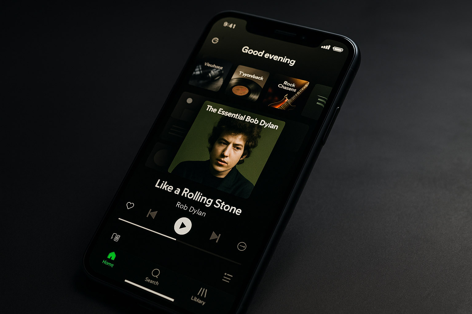 Spotify mobile app screens showing dark themed interface with large album covers and simplified navigation.
